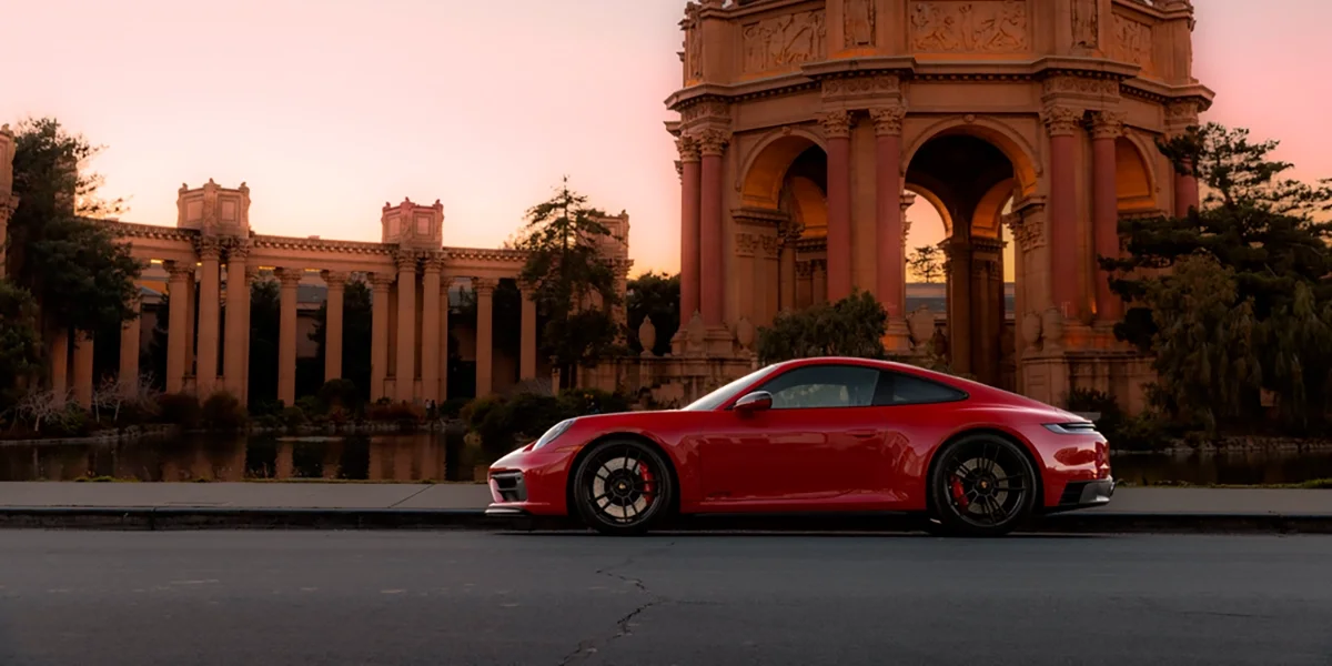 Red Porsche 911 parked at the Palace of Fine Arts in San Francisco at sunset – Porsche Marin performance car photography.